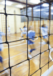 Player preparing to serve a volleyball overhand